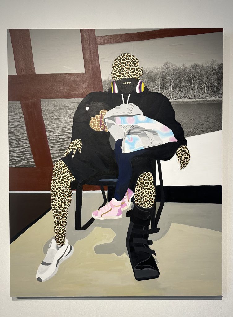 Always Sleep in Paw Paw's Lap (2025). Acrylic, tissue paper, vellum on canvas. 60 x 48 inches. Image Description: A young girl with giraffe skin leans over and cuddles in the lap of Paw Paw with her pink sneakers dangling. Paw Paw’s leopard skin is partially covered with a black sweatshirt and shorts with one leg in a boot brace and the other with a white sneaker. The background of a black and white photograph of trees and water is framed behind brown vertical and horizontal strokes. Artwork photographed by Chanika Svetvilas. Image reproduced in Wordgathering with permission of the original artist, Jazlyne Sabree, and the photographer of the work, Chanika Svetvilas.